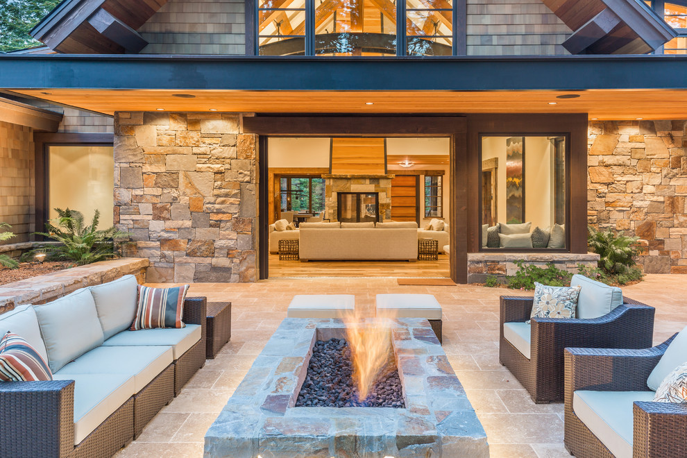 Inspiration for a mediterranean backyard stone patio remodel in San Francisco with a fire pit and no cover