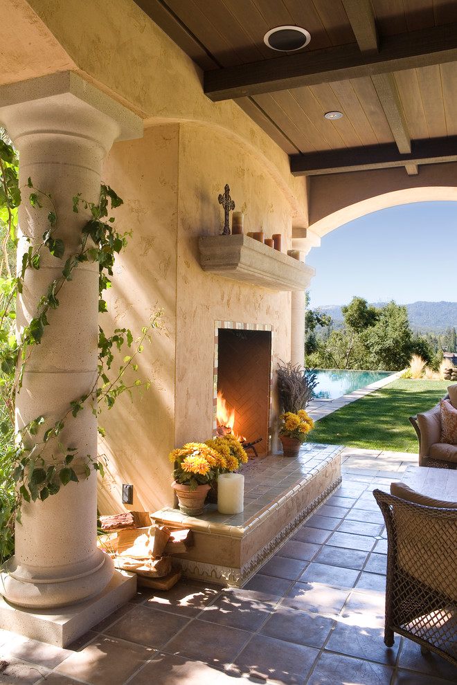 This is an example of a mediterranean patio in San Francisco with a fire feature.
