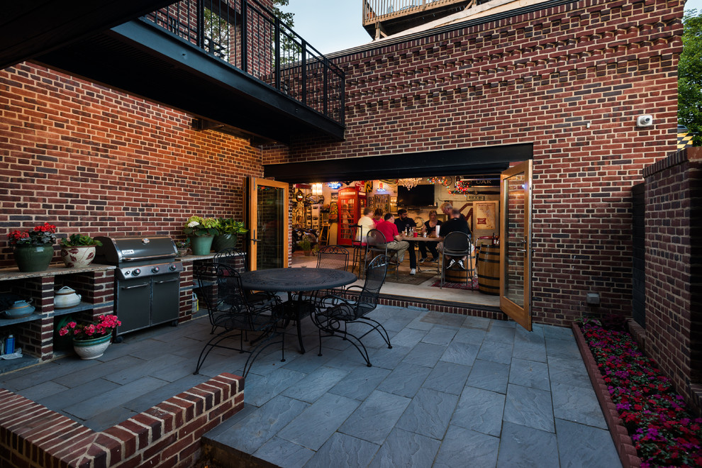 Idee per un patio o portico moderno in cortile e di medie dimensioni con pavimentazioni in pietra naturale e nessuna copertura
