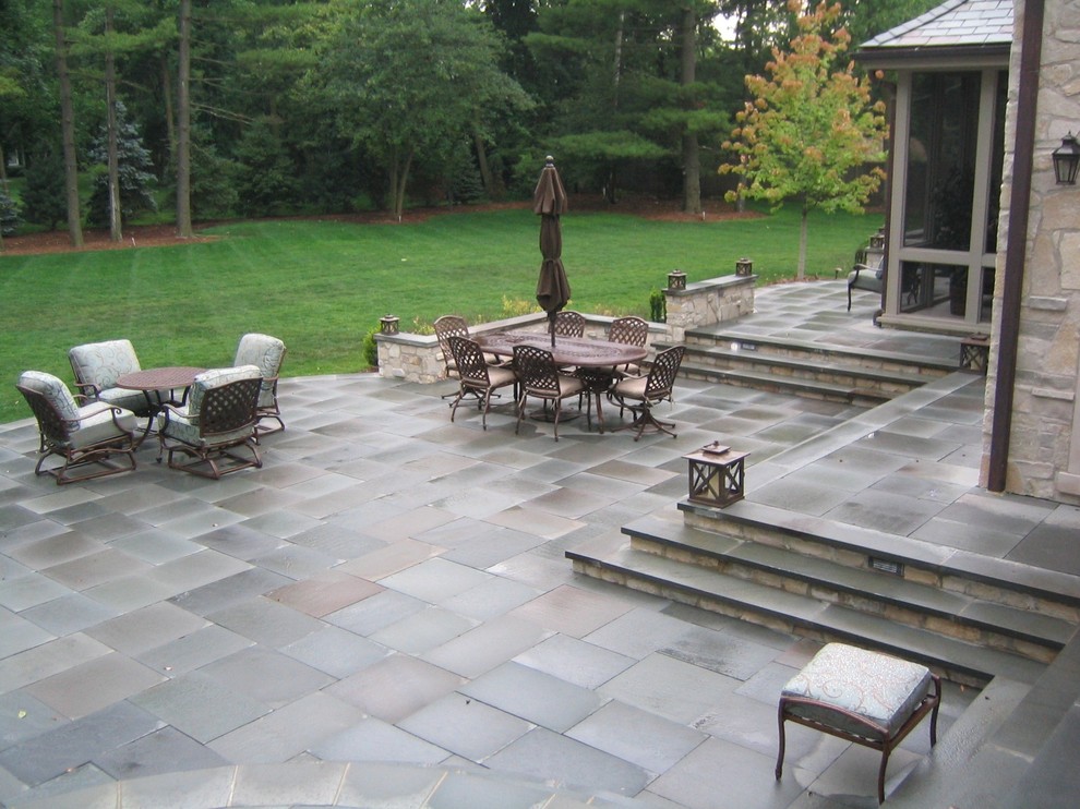 Inspiration for a large timeless backyard concrete patio remodel in Chicago with no cover