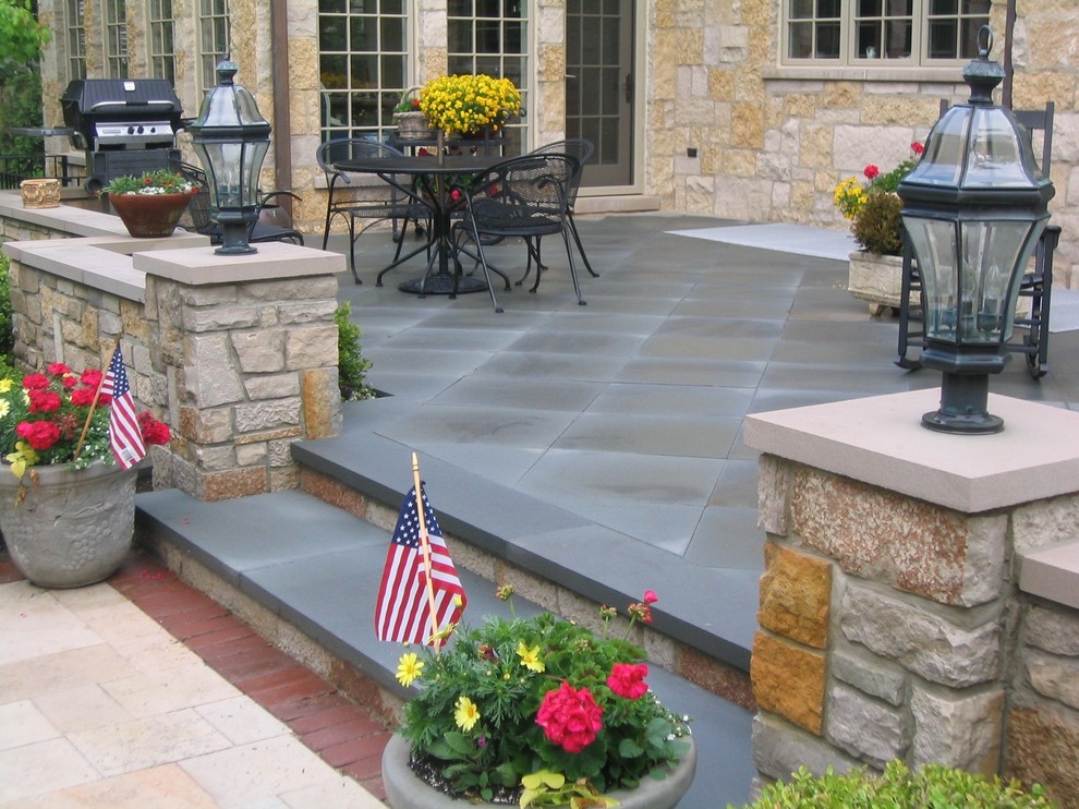 Patio - large traditional backyard concrete patio idea in Chicago with no cover