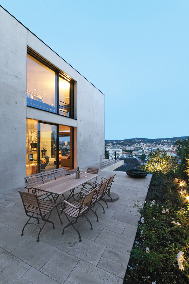 This is an example of a large contemporary patio in Stuttgart with no cover.