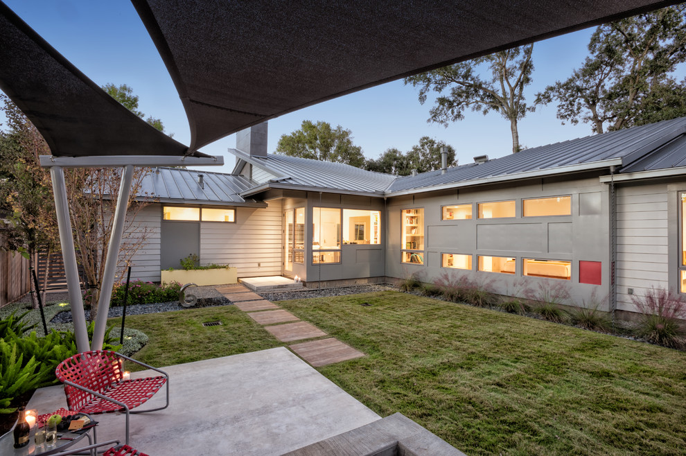 Patio - 1960s backyard concrete patio idea in Houston