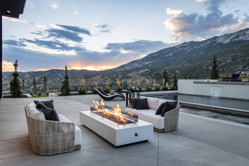 Design ideas for a contemporary patio in Salt Lake City with a fire feature and no cover.