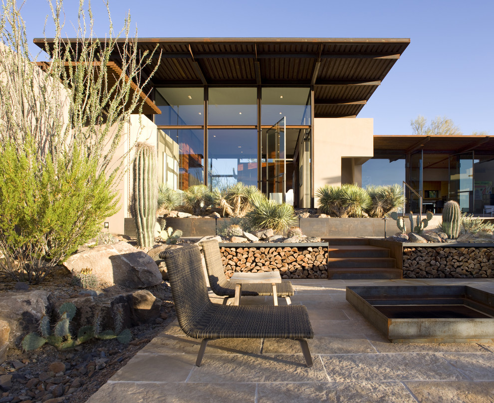 Inspiration for a southwestern patio remodel in Phoenix with a fire pit