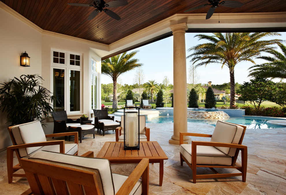 Inspiration for a large classic back patio in Tampa with tiled flooring and a roof extension.