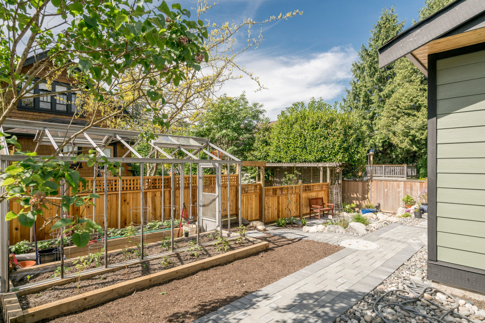 Photo of a small traditional back patio in Vancouver with a vegetable patch, concrete paving and no cover.