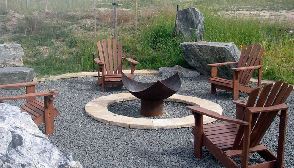 Inspiration for a contemporary patio remodel in Grand Rapids with a fire pit