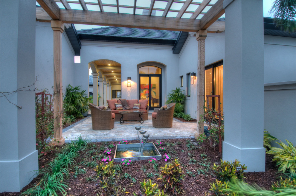 Inspiration for a classic patio in Tampa with a pergola.