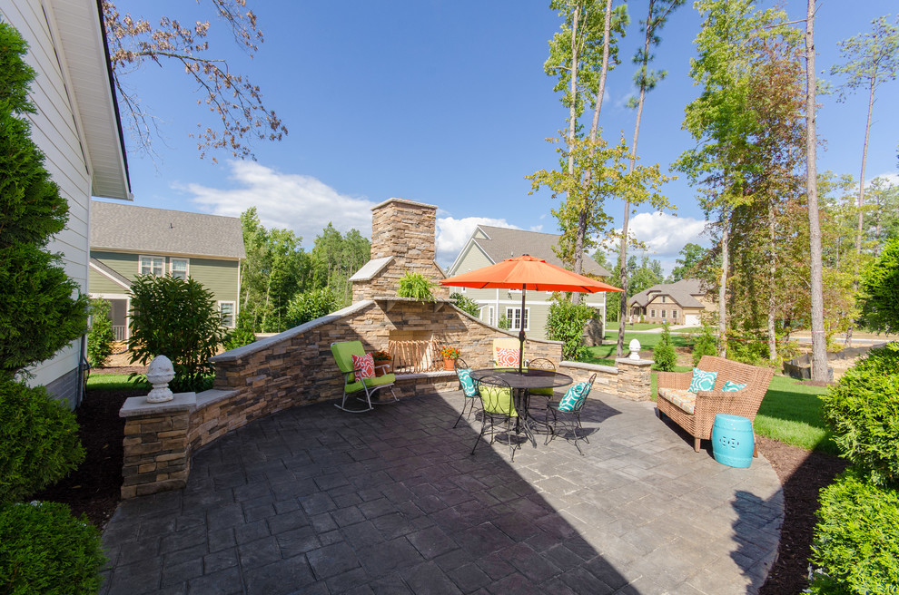 Mid-sized farmhouse backyard patio photo in Richmond with a fire pit and no cover
