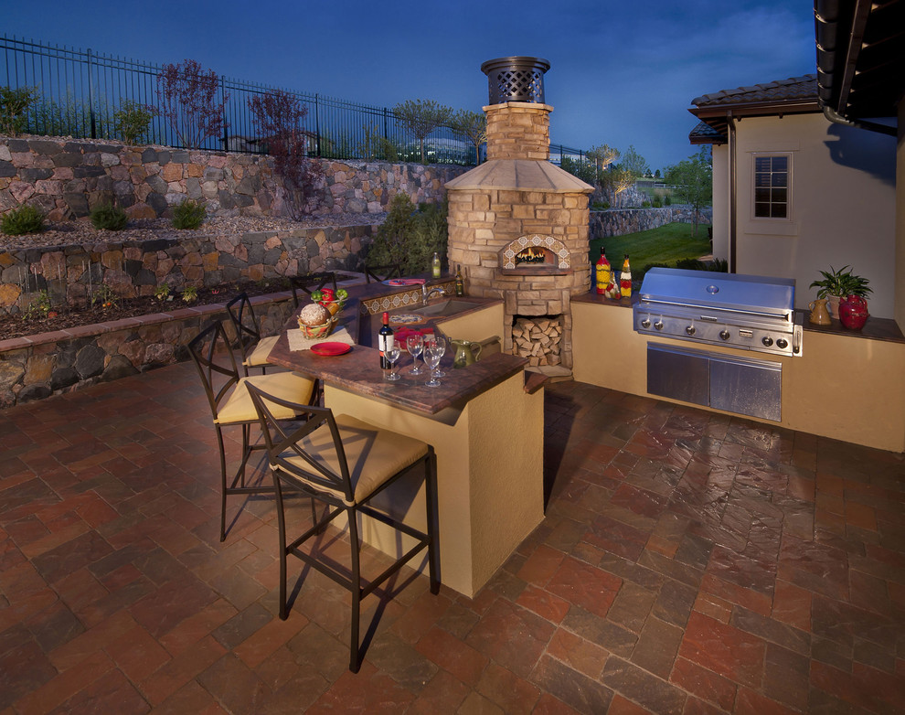 Example of a tuscan patio design in Denver