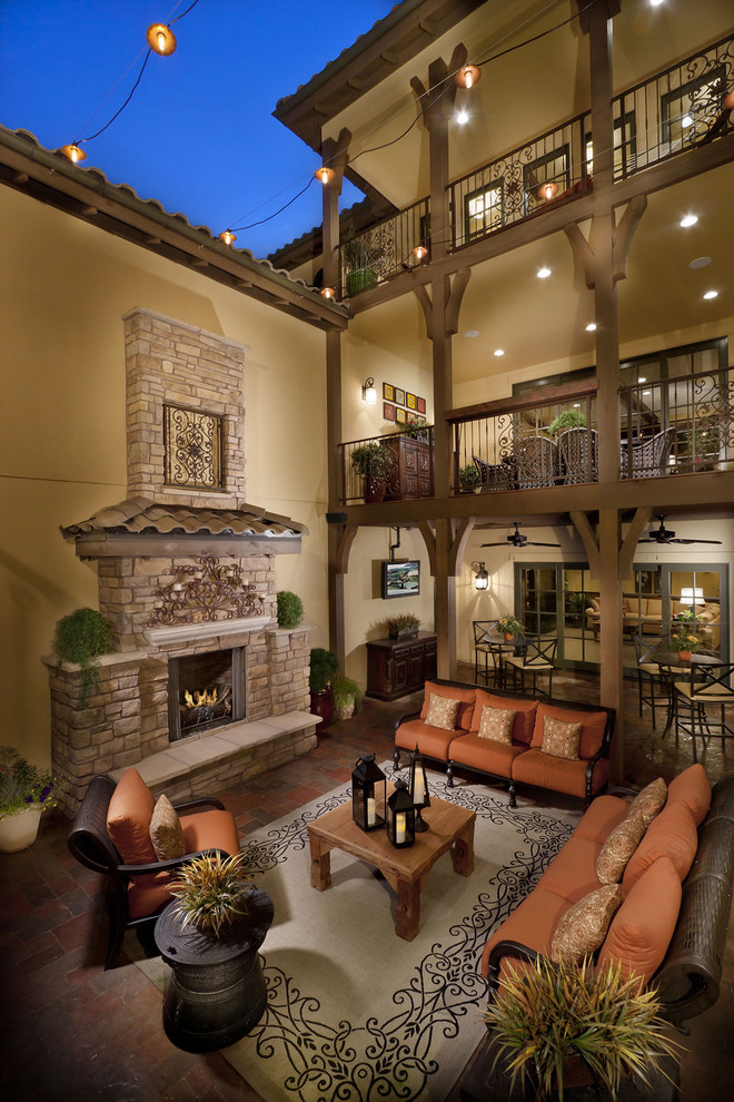 Inspiration for a mediterranean patio remodel in Denver with a fire pit