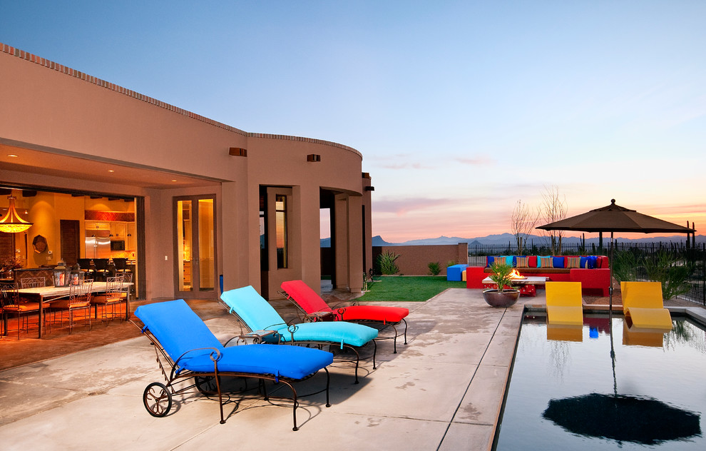 Inspiration for a southwestern concrete patio remodel in Phoenix with no cover