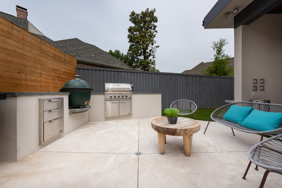 Photo of a large contemporary back patio in Dallas with a fireplace, stamped concrete and a pergola.