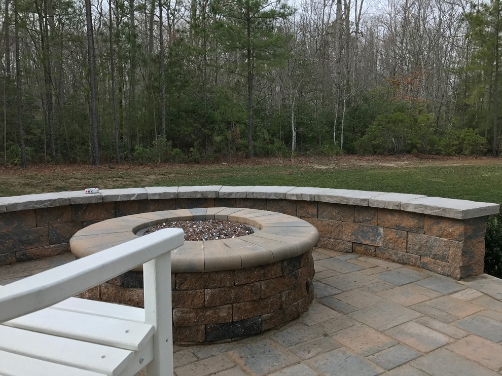 Patio - mid-sized traditional backyard concrete paver patio idea in Cincinnati with a fire pit and no cover