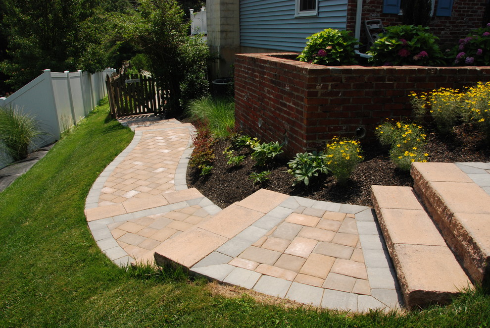 Inspiration for a timeless side yard concrete paver patio remodel in Philadelphia