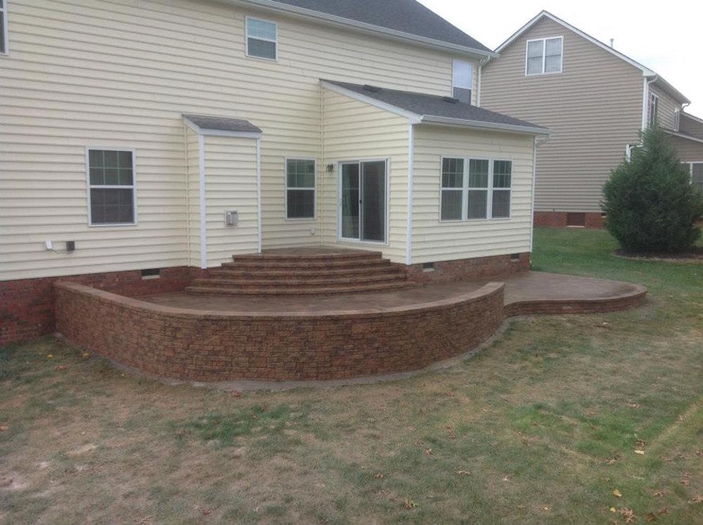 Design ideas for a medium sized traditional back patio in Richmond with brick paving.