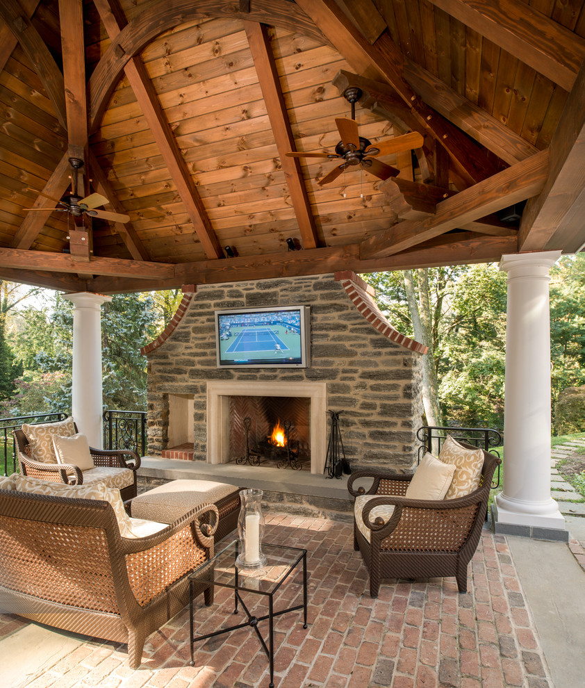 Classic patio in Philadelphia with a fire feature and a gazebo.