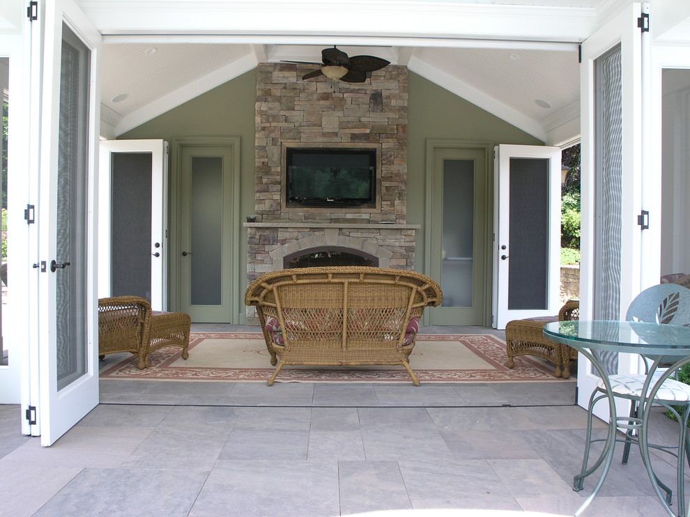 Patio - large transitional backyard stone patio idea in New York with a fire pit and a gazebo