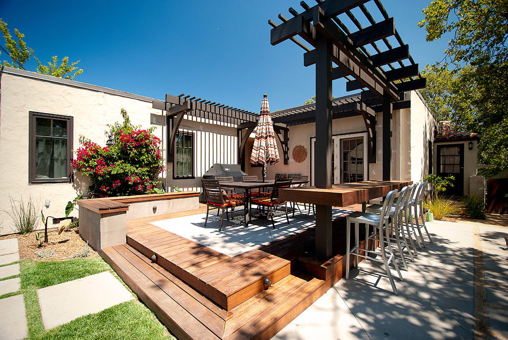 Patio - mid-sized contemporary side yard patio idea in San Francisco with decking and a pergola