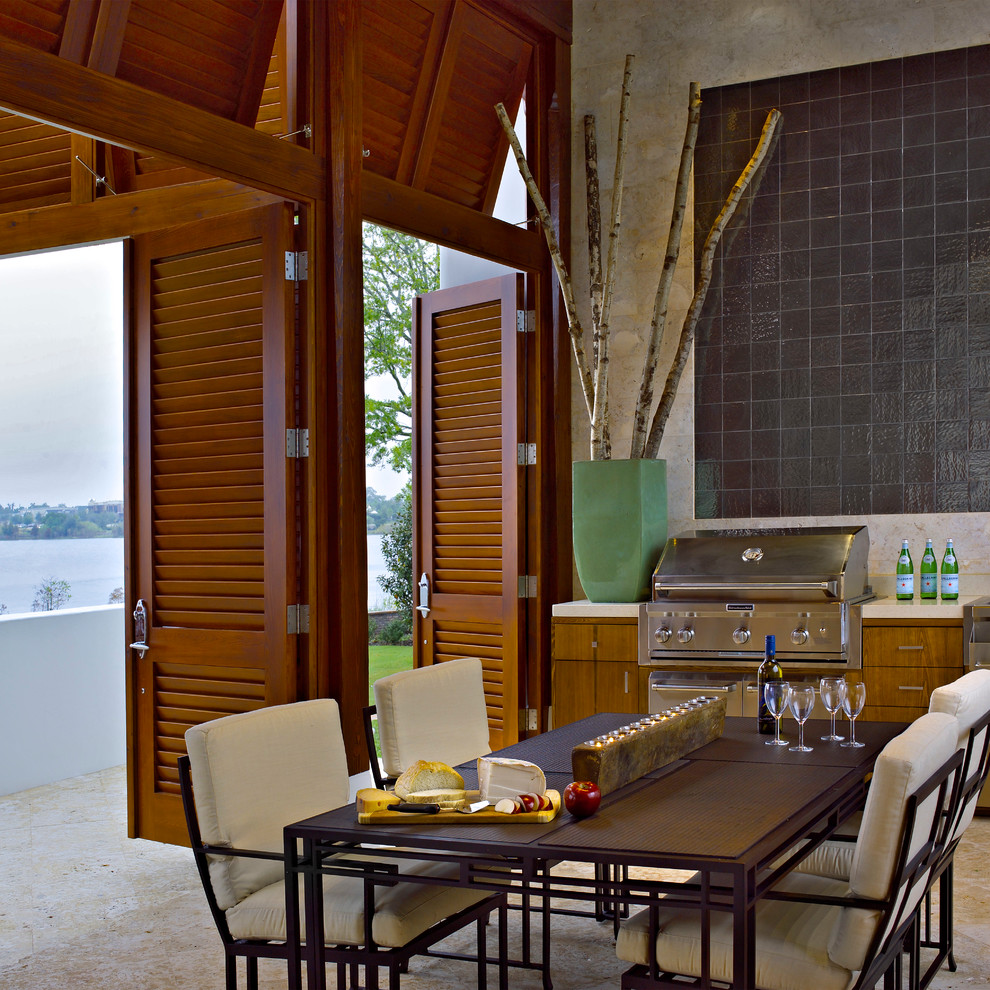 Example of a trendy patio design in Orlando with a roof extension