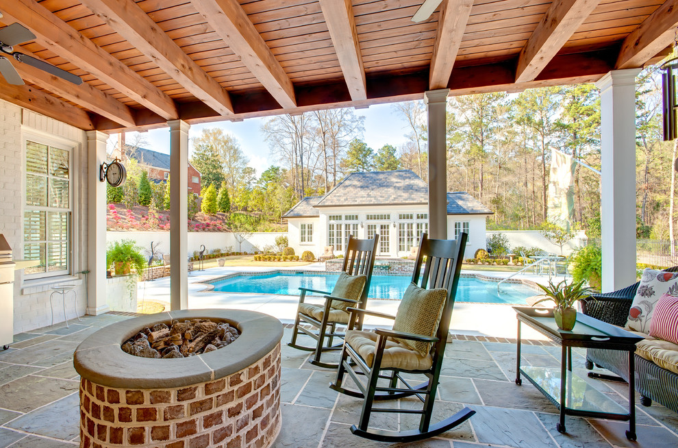 Mid-sized arts and crafts backyard tile patio photo in Atlanta with a fire pit and a roof extension