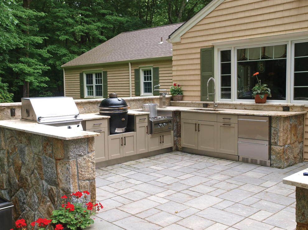 This is an example of a classic patio in New York with natural stone paving, no cover and a bbq area.