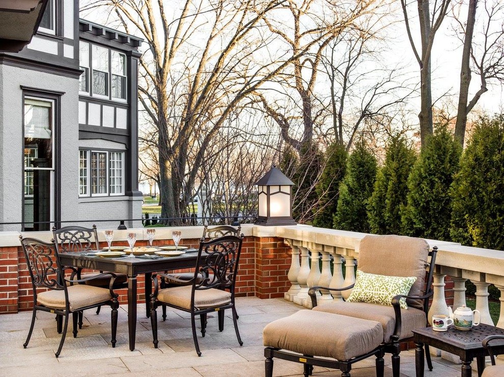 Mid-sized elegant backyard stone patio photo in Chicago with no cover