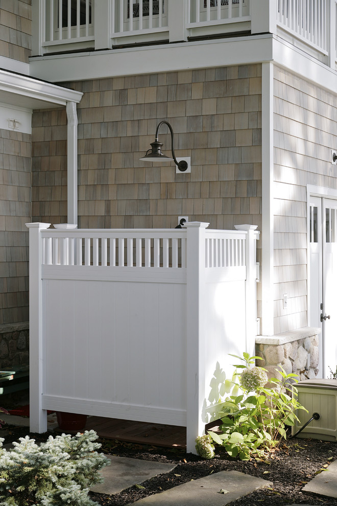 Inspiration for a huge timeless stamped concrete outdoor patio shower remodel in Other