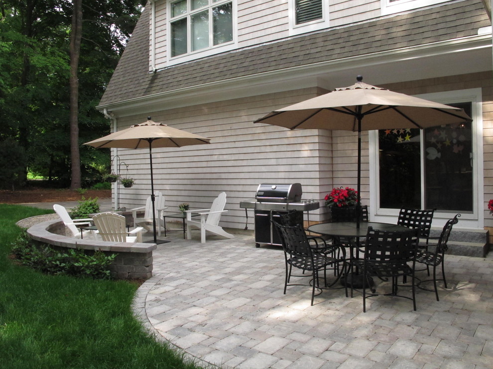 Inspiration for a timeless backyard concrete paver patio remodel in Boston