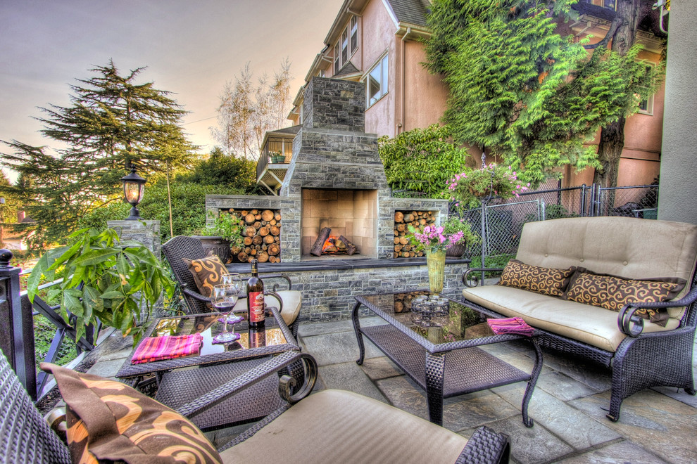 Example of a classic patio design in Portland with a fire pit