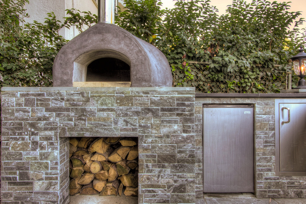 Photo of a traditional patio in Portland with an outdoor kitchen.
