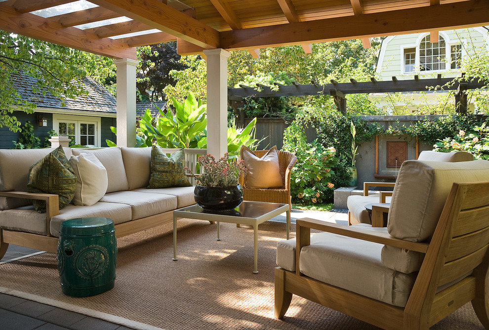 Patio - traditional backyard patio idea in Portland with a pergola