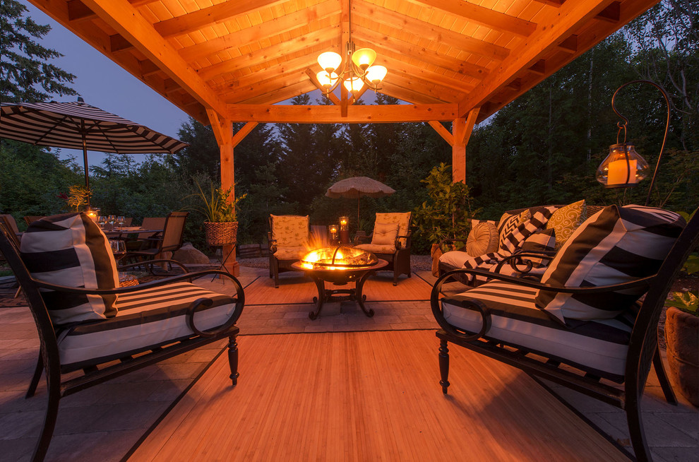 Inspiration for a large contemporary backyard brick patio remodel in Portland with a fire pit and a gazebo