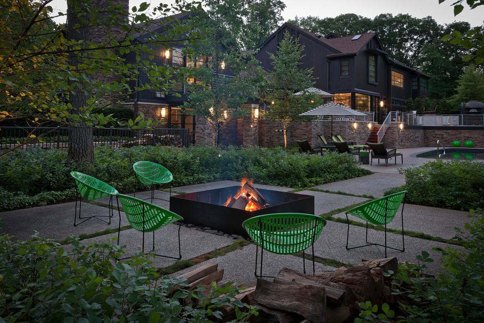 Photo of a large classic back patio in Detroit with a fire feature.