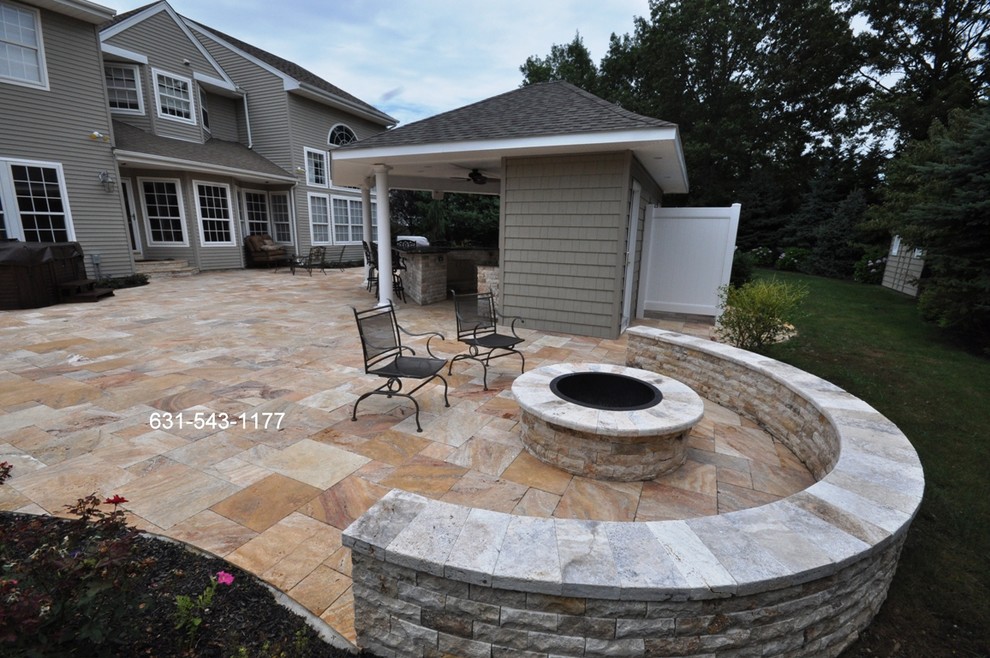 Travertine Fire Pit & Sitting Wall Built by Gappsi on Long Island Traditional Patio New