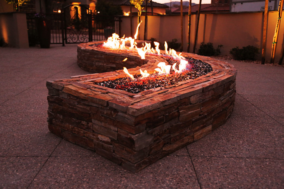 Large southwest backyard concrete patio photo in Salt Lake City with a fire pit and no cover