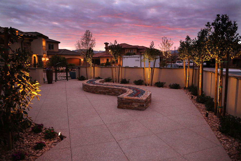 Large southwest backyard concrete patio photo in Salt Lake City with a fire pit and no cover