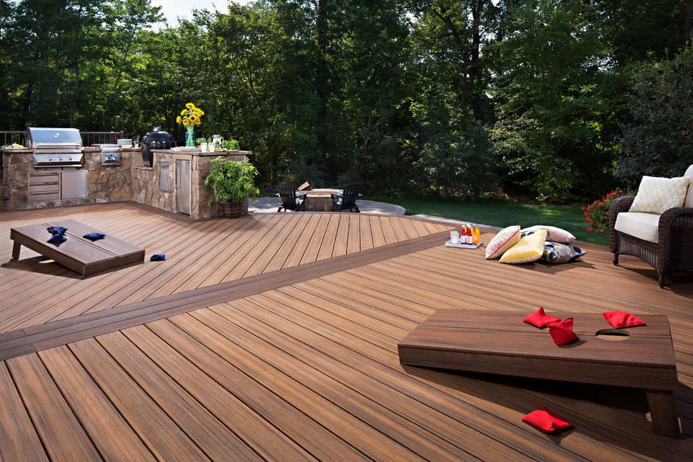 Photo of a large modern back patio in DC Metro with decking and no cover.