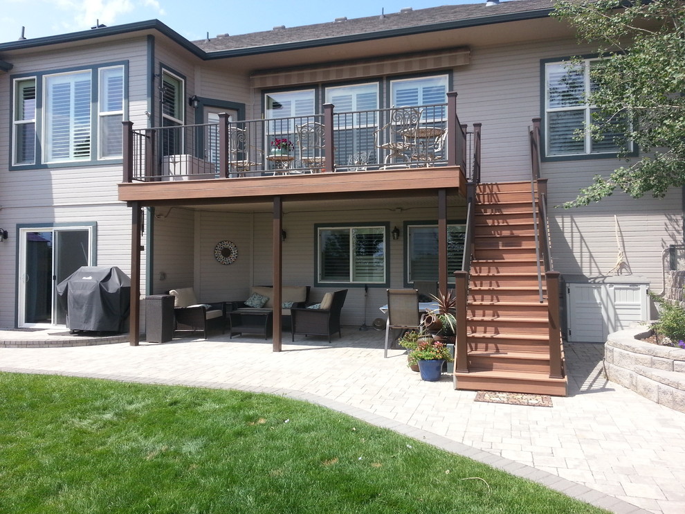 Photo of a medium sized traditional back patio in Denver with concrete paving.