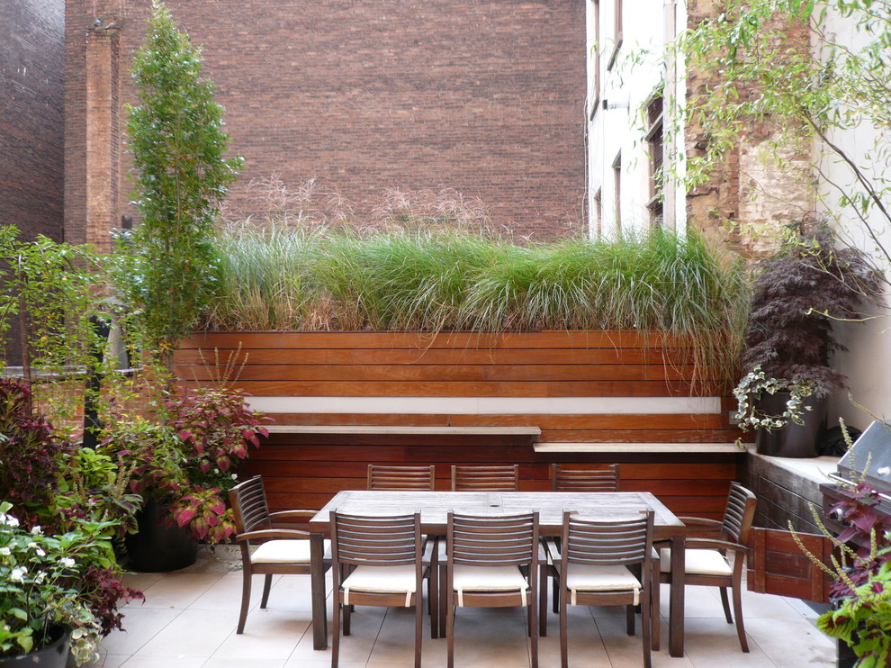 Photo of a contemporary patio in New York with no cover and a bbq area.
