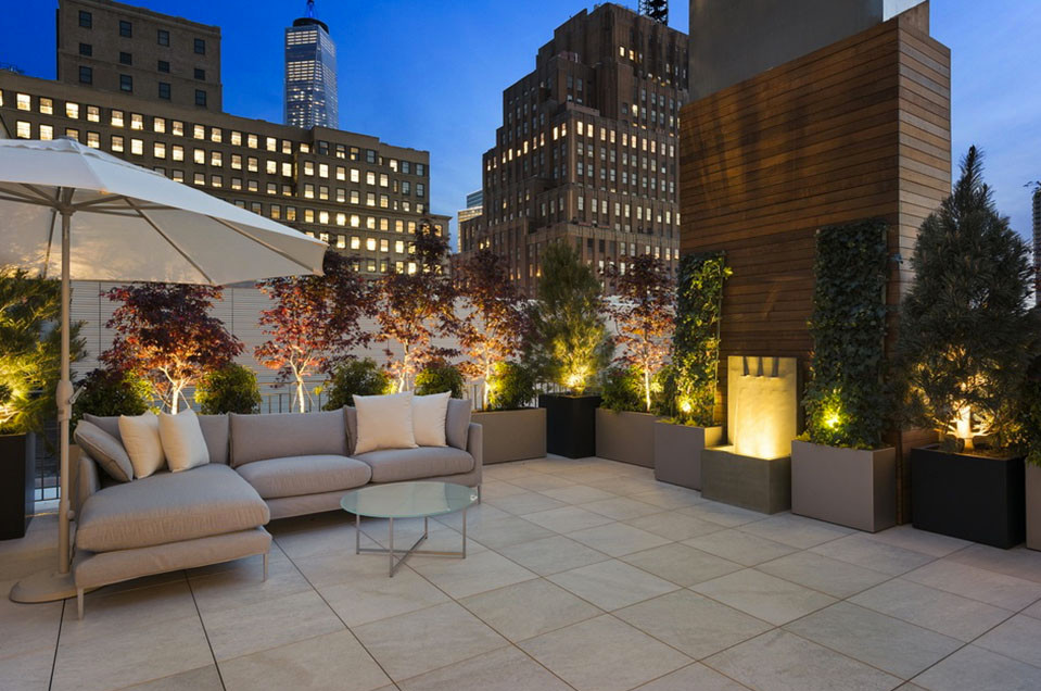 Inspiration for a large contemporary patio in New York with an outdoor kitchen, tiled flooring and no cover.