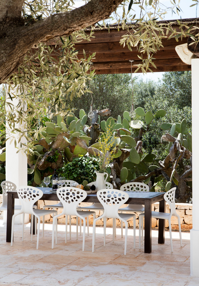 Mediterranean patio with a pergola.