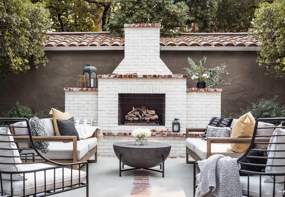 Patio - large backyard brick patio idea in Sacramento with a fireplace