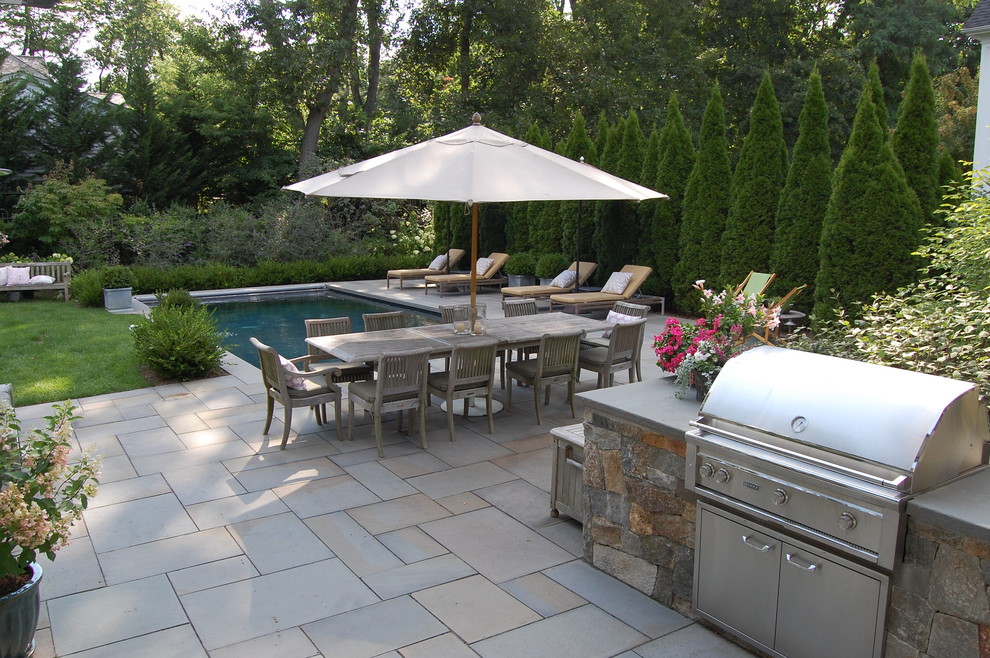 Photo of a traditional patio in New York with no cover and a bbq area.