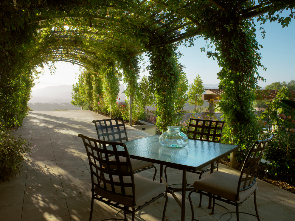 This is an example of a mediterranean patio in San Francisco with a pergola.