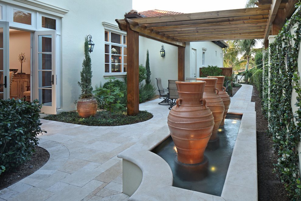 Patio - mediterranean patio idea in Miami