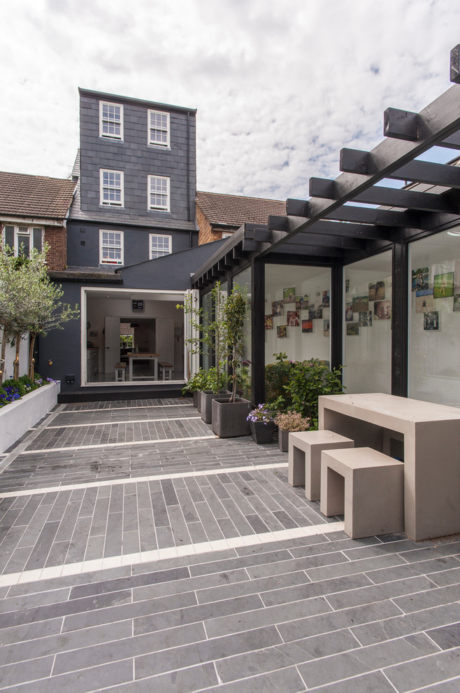 Patio - modern patio idea in London