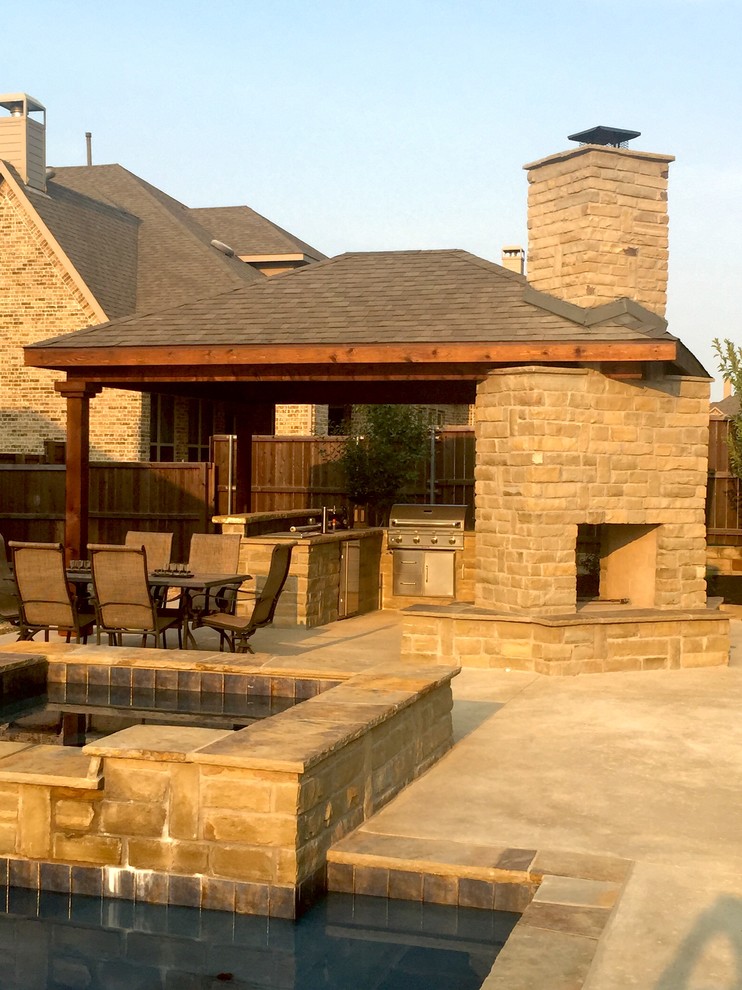 Example of a mid-sized classic backyard concrete patio kitchen design in Dallas with a gazebo