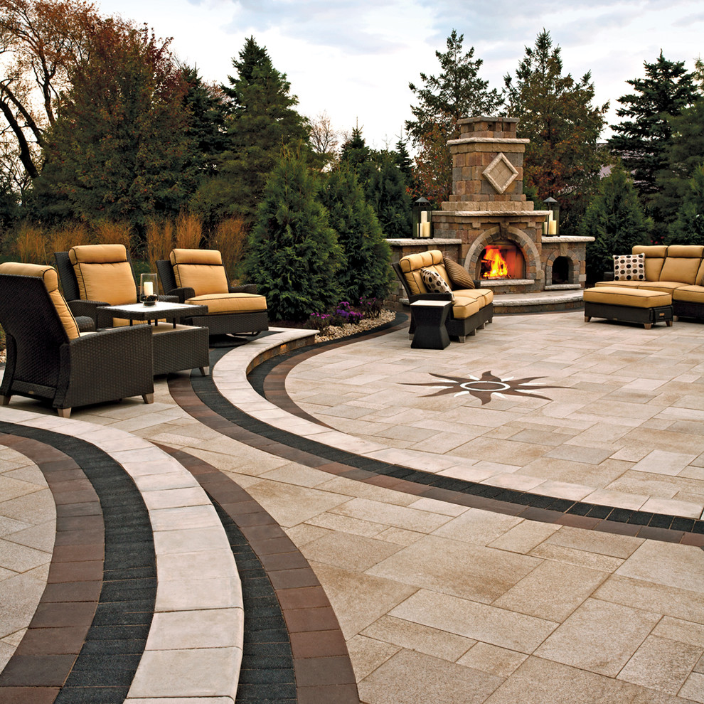 Elegant backyard concrete paver patio photo in Other with a fire pit and no cover